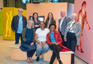 A photograph of the Outwitting Cancer Patient Advisory Board sitting in the exhibition